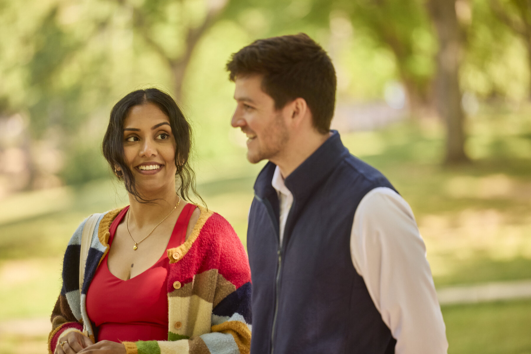 Saanvi and Nate walking side by side in the park